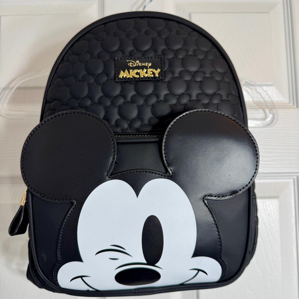 NWT. Disney Primark Mickey Mouse Embossed Backpack winking Mickey Mouse